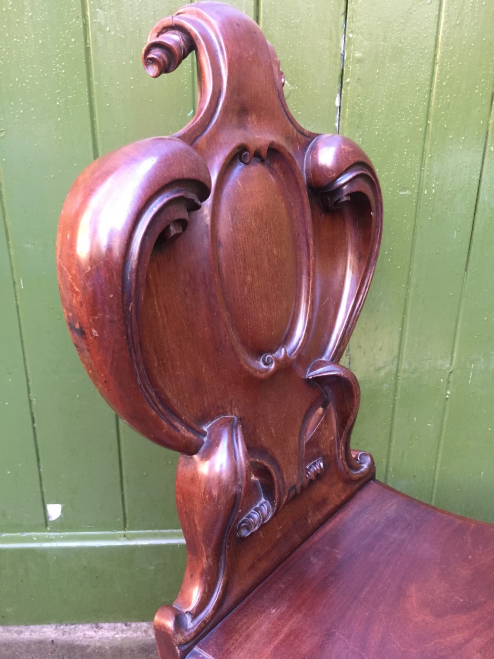 A high quality Victorian mahogany hall chair of particularly bold and flamboyant design  View VIII