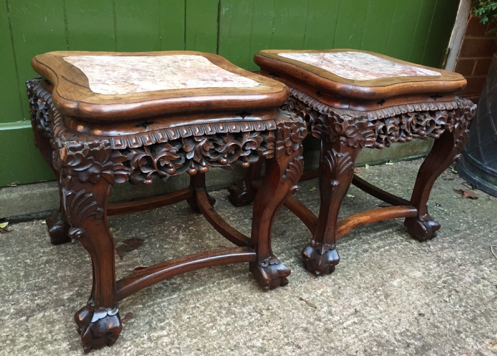 Pair of late C19th Chinese Qing Dynasty carved hardwood inset marble top low jardiniere stands or end tables.