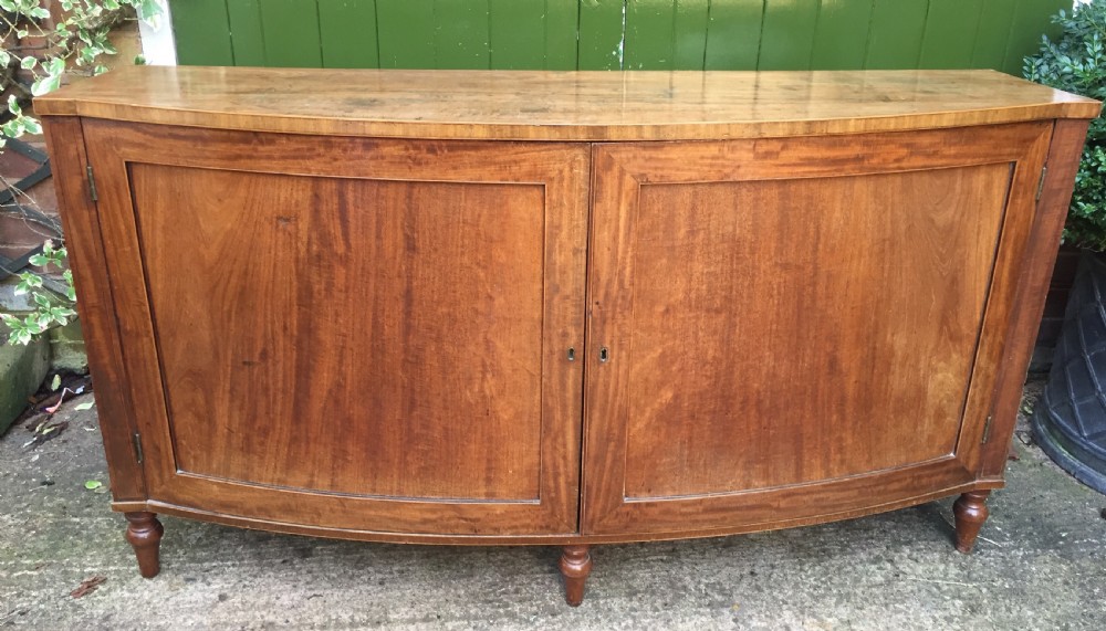 Elegant late C18th George III period mahogany bow-fronted 2-door side cabinet of restrained design and rare narrow proportions.