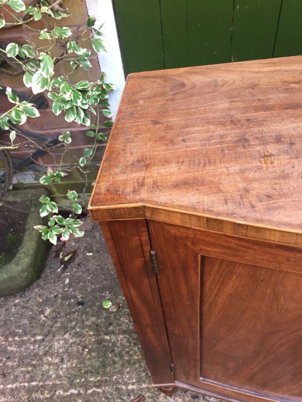 Elegant late C18th George III period mahogany bow-fronted 2-door side cabinet of restrained design and rare narrow proportions. View II