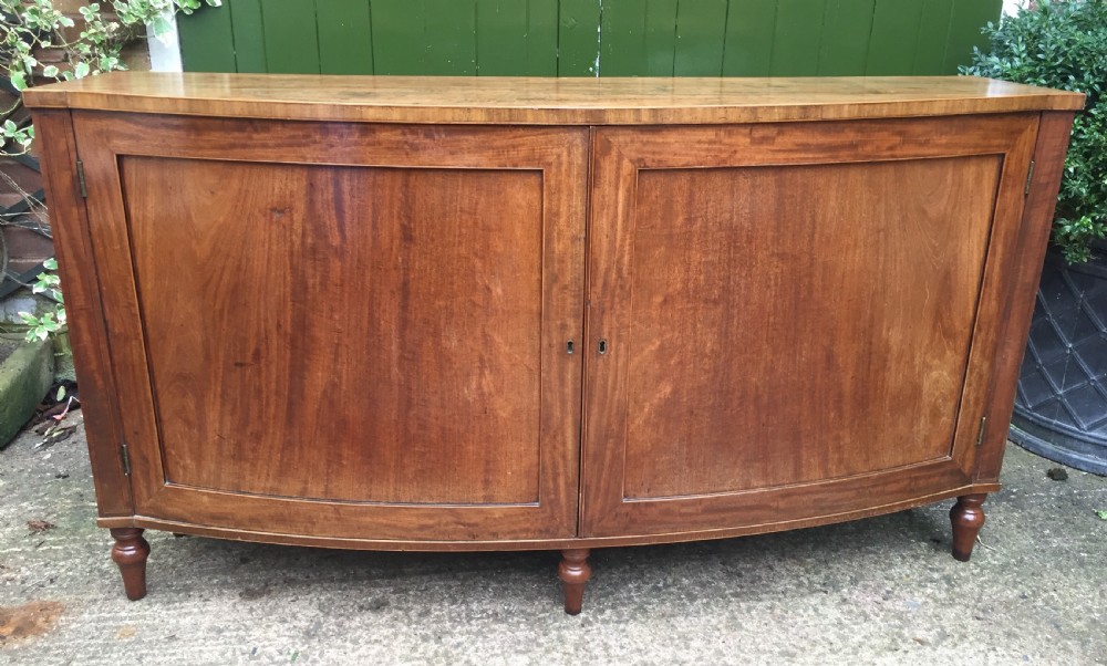Elegant late C18th George III period mahogany bow-fronted 2-door side cabinet of restrained design and rare narrow proportions. View IV