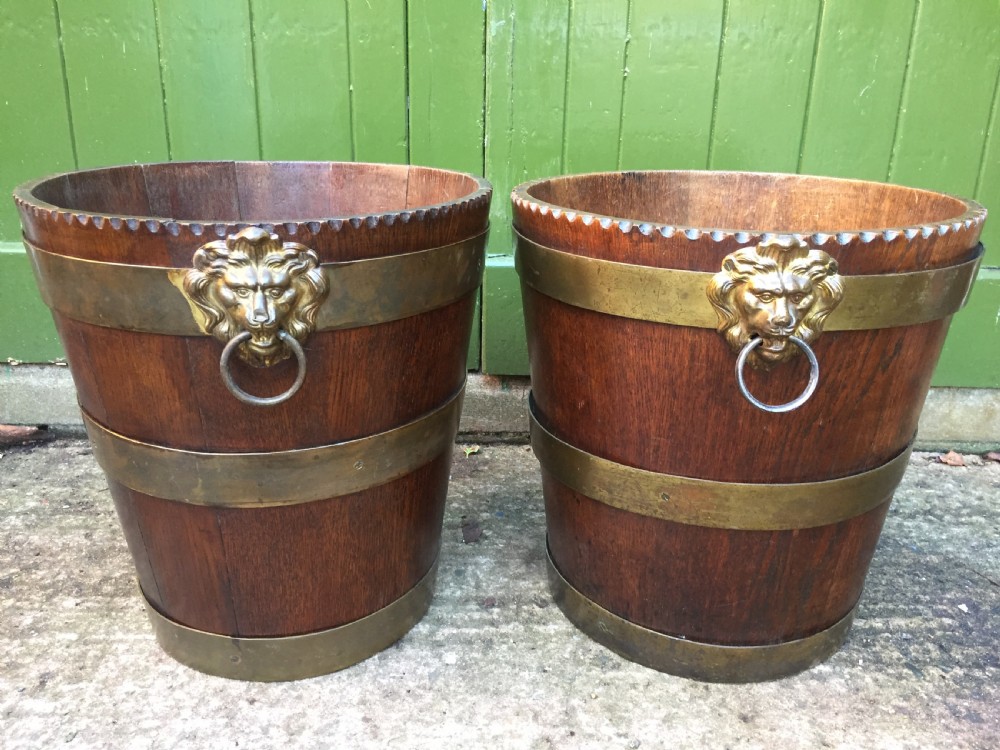 Pair of early C19th brass-bound oak log or peat fireside buckets fitted with brass lions-mask ring handles . View III