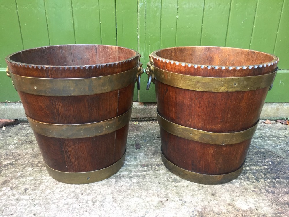 Pair of early C19th brass-bound oak log or peat fireside buckets fitted with brass lions-mask ring handles . View V