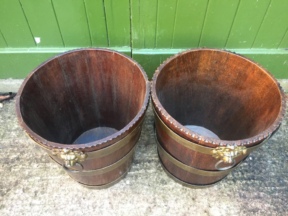 Pair of early C19th brass-bound oak log or peat fireside buckets fitted with brass lions-mask ring handles . View X