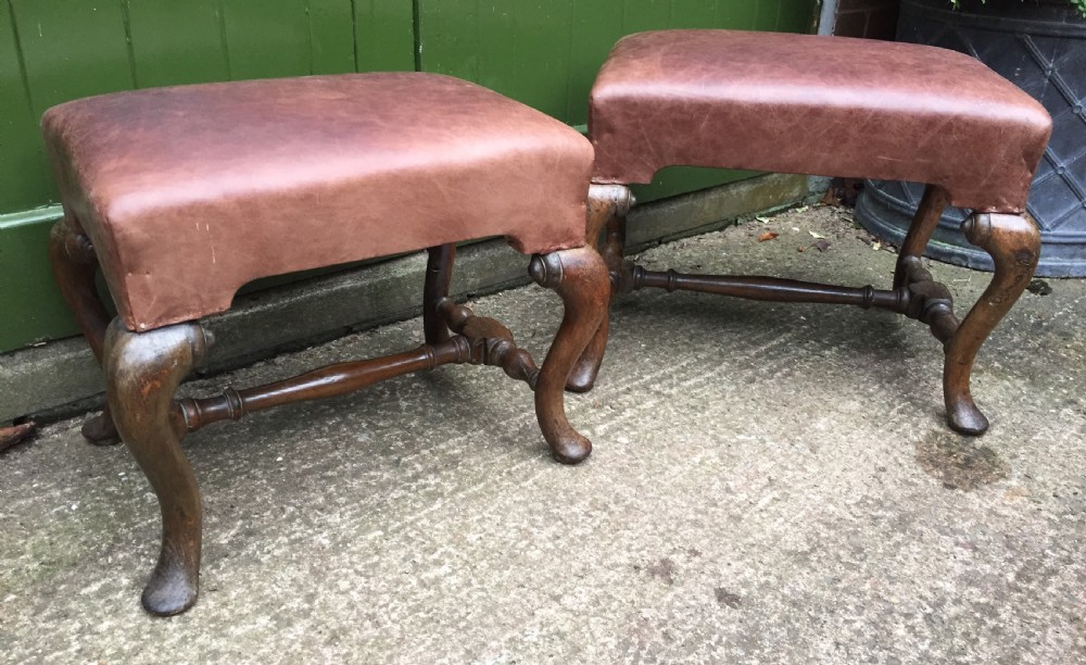 Pair of C19th oak-framed cabriole legged leather top stools in the early C18th manner.