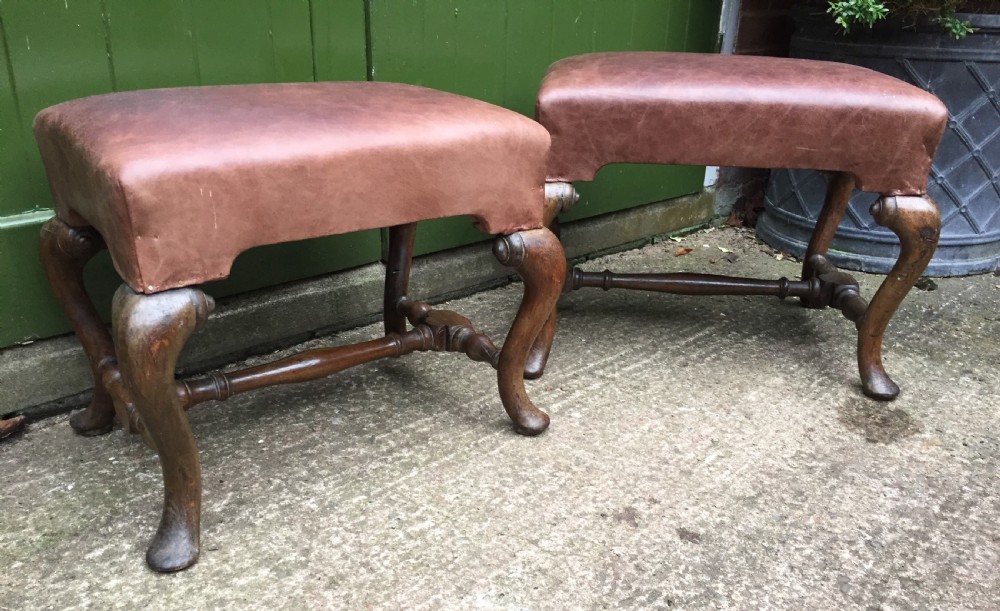 Pair of C19th oak-framed cabriole legged leather top stools in the early C18th manner. View II