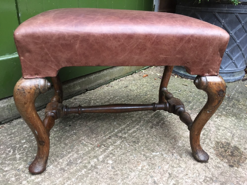 Pair of C19th oak-framed cabriole legged leather top stools in the early C18th manner. View IV