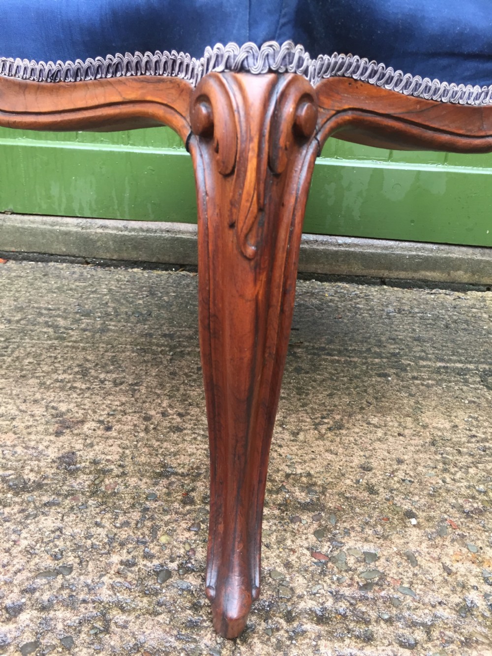 A large mid-nineteenth-century square Victorian stool featuring carved walnut cabriole legs and a blue upholstered top trimmed with gimp braid. View III