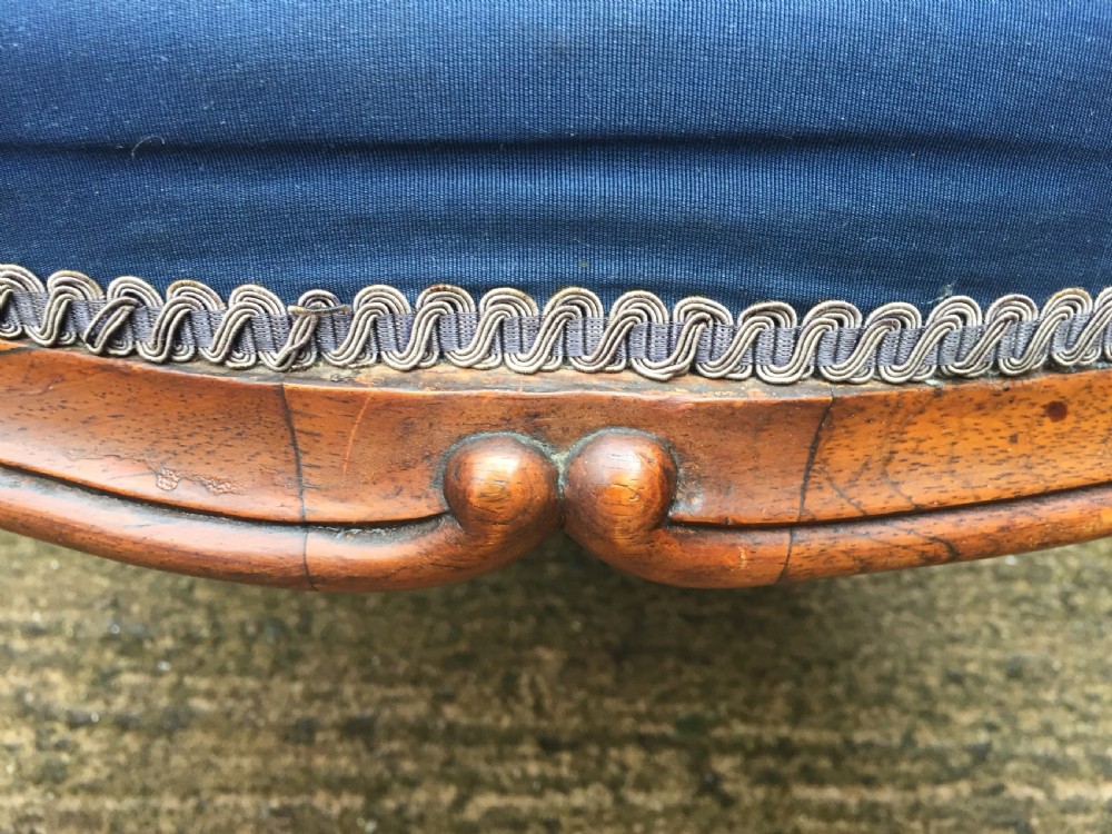A large mid-nineteenth-century square Victorian stool featuring carved walnut cabriole legs and a blue upholstered top trimmed with gimp braid. View IX
