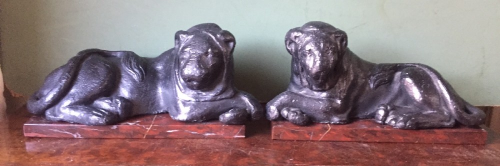 Pair of early C19th 'Grand Tour' souvenir patinated cast-lead lions mounted upon rouge griotte marble plinth bases , copies of the Egyptian lions from The Vatican, Rome. View III