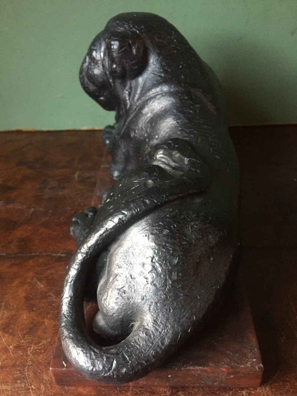 Pair of early C19th 'Grand Tour' souvenir patinated cast-lead lions mounted upon rouge griotte marble plinth bases , copies of the Egyptian lions from The Vatican, Rome. View X