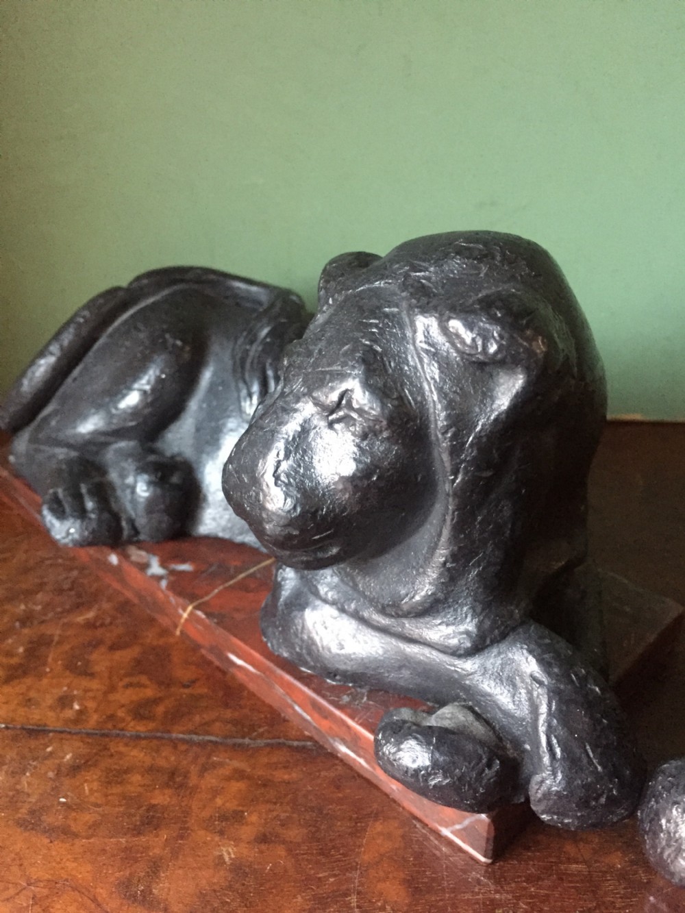 Pair of early C19th 'Grand Tour' souvenir patinated cast-lead lions mounted upon rouge griotte marble plinth bases , copies of the Egyptian lions from The Vatican, Rome. View XII