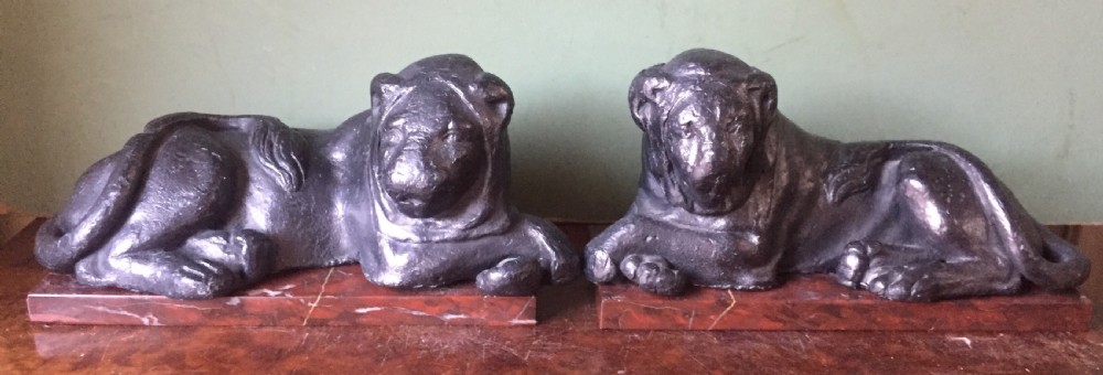 Pair of early C19th 'Grand Tour' souvenir patinated cast-lead lions mounted upon rouge griotte marble plinth bases , copies of the Egyptian lions from The Vatican, Rome. View XV