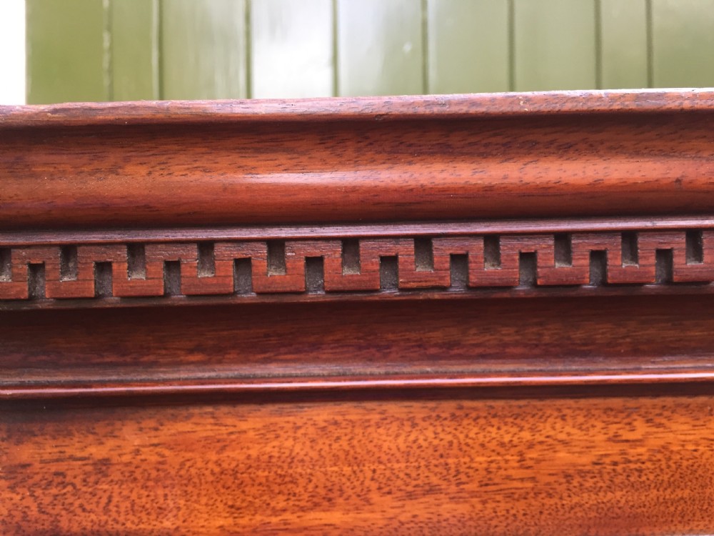 A late eighteenth-century George III mahogany chest-on-chest featuring a dentil moulding cornice, two short over five long graduated drawers with brass swan-neck handles, supported on bracket feet. View X