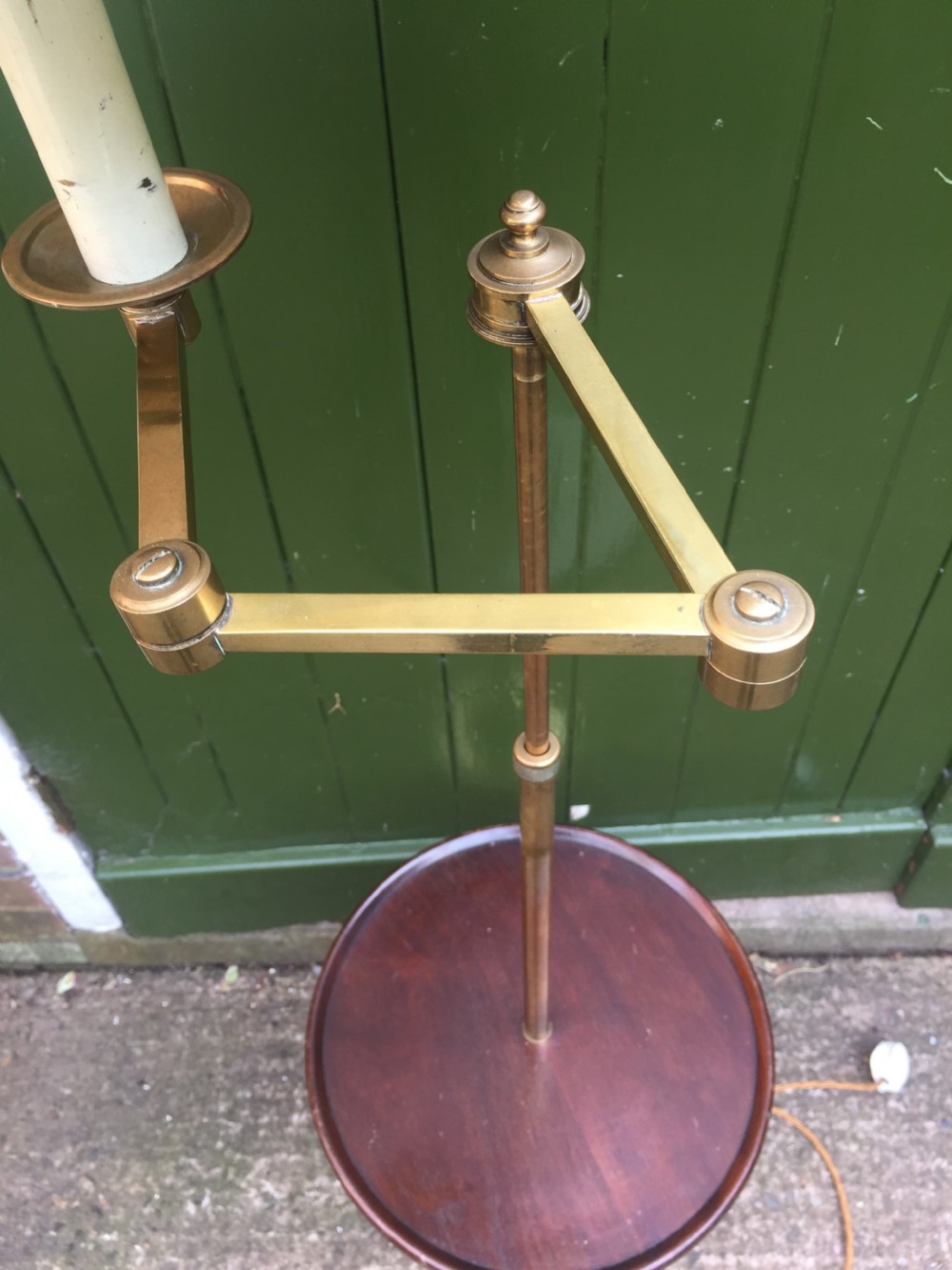 Stylish and practical early C20th brass and mahogany reading lamp with articulated lateral arm and adjustable height column . View VIII
