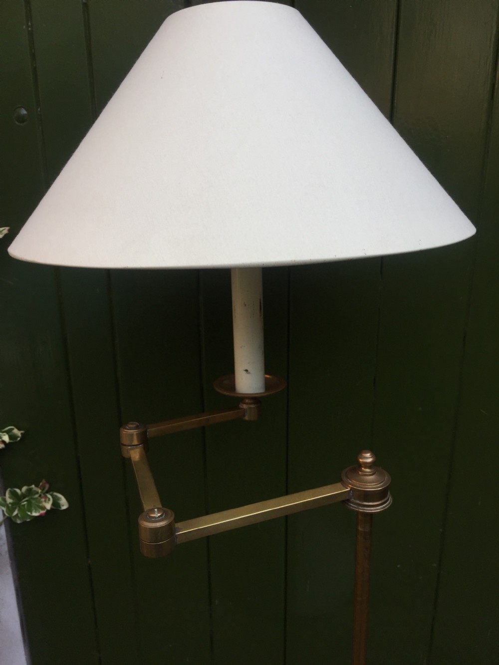 Stylish and practical early C20th brass and mahogany reading lamp with articulated lateral arm and adjustable height column . View XI