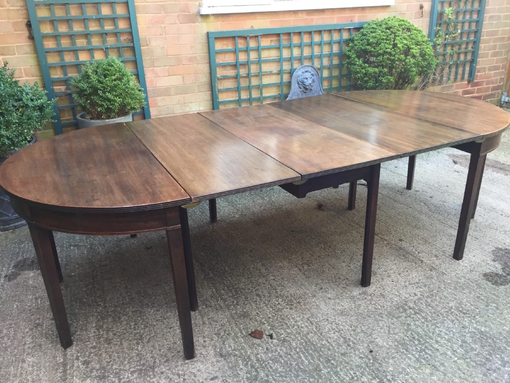 Highly versatile C18th George III period mahogany D-ended dining table with various configuration options in 'as found' country-house condition. View IV