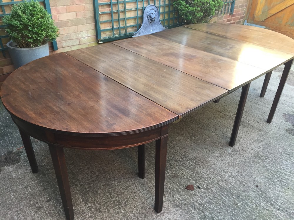 Highly versatile C18th George III period mahogany D-ended dining table with various configuration options in 'as found' country-house condition. View V