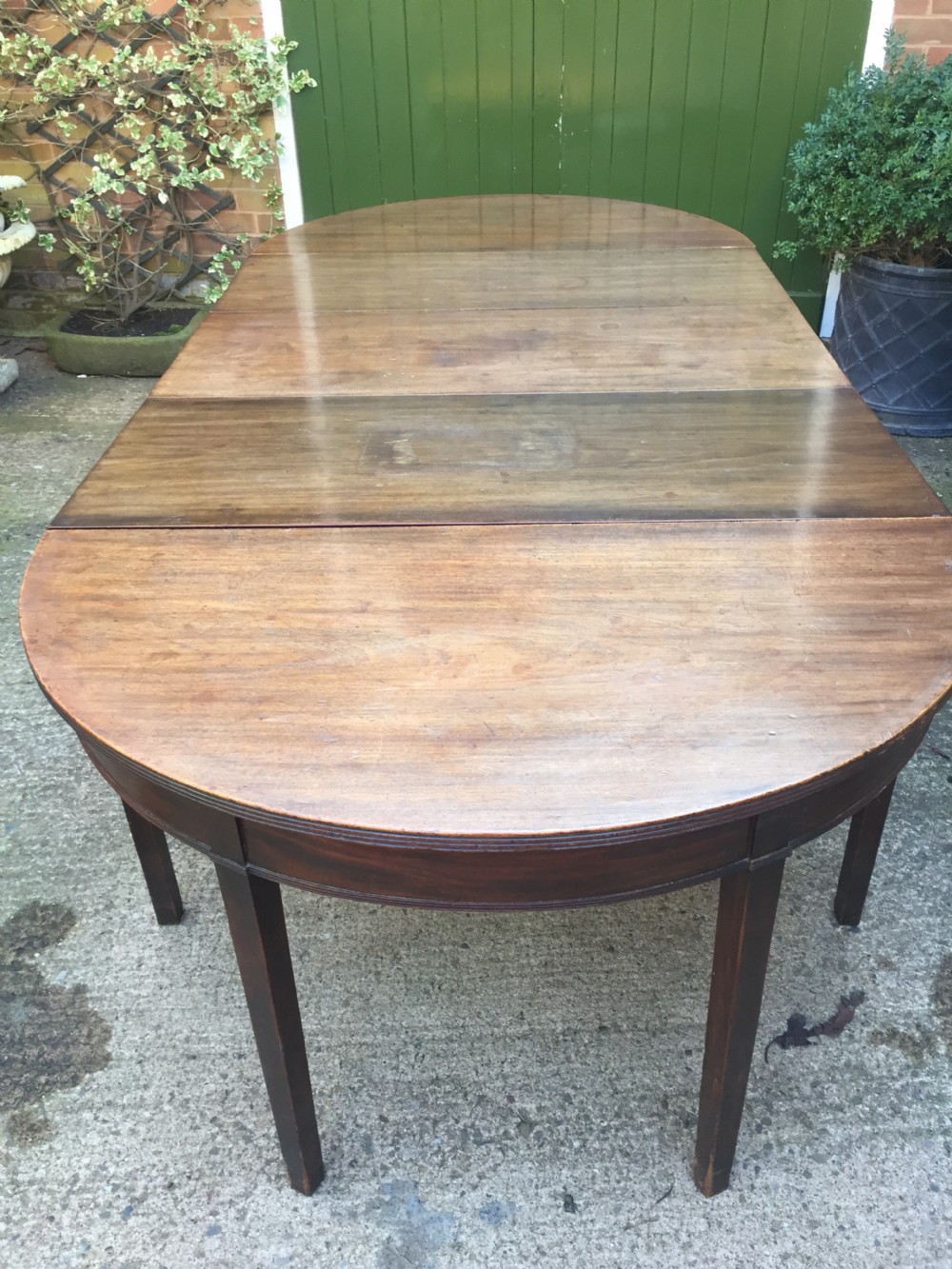 Highly versatile C18th George III period mahogany D-ended dining table with various configuration options in 'as found' country-house condition. View X