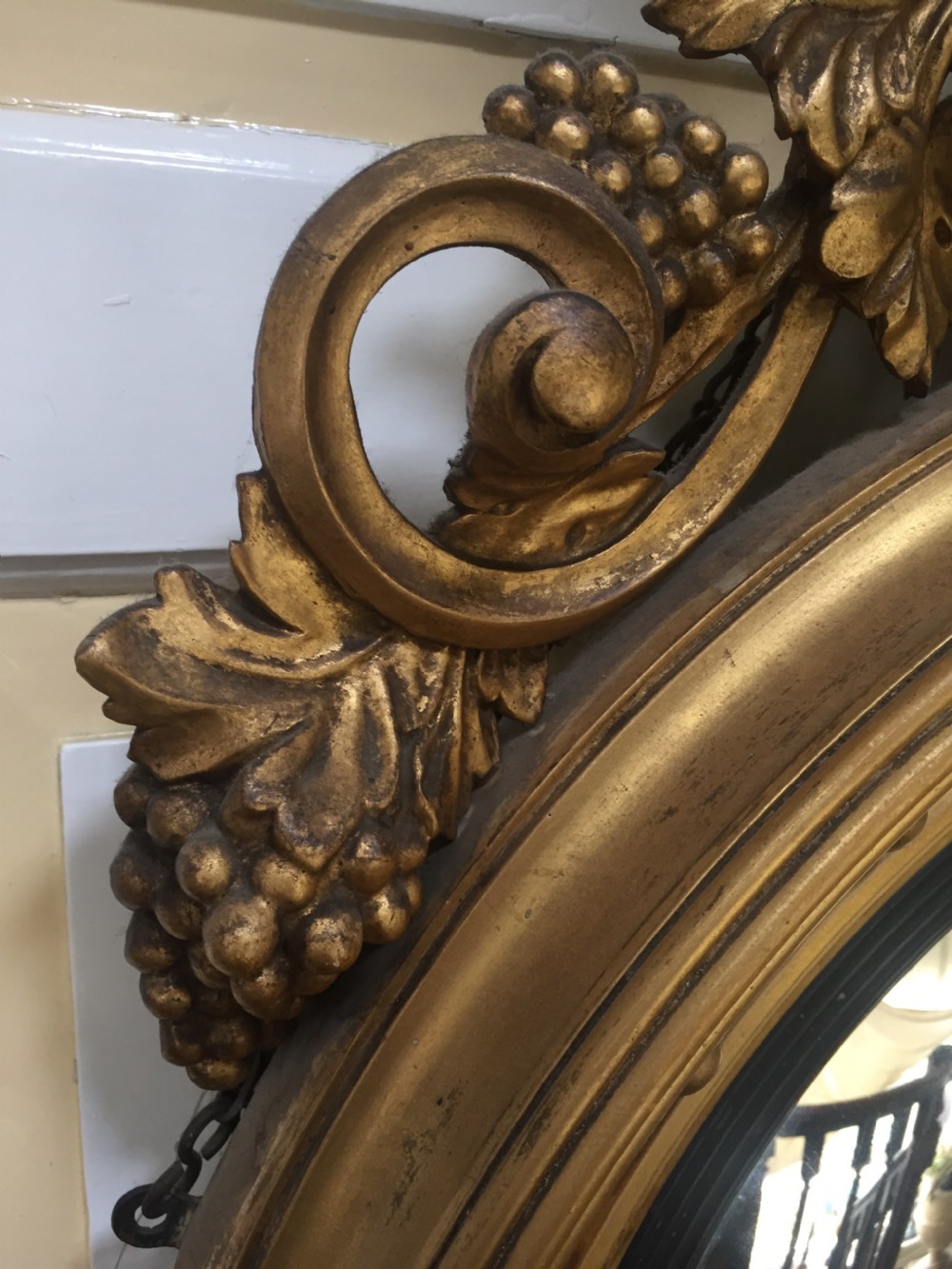 Large and impressive Regency period carved gilt-wood frame girandole convex mirror with eagle surmount. View VI