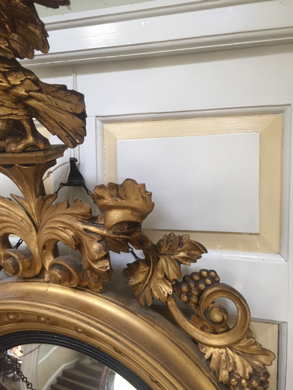 Large and impressive Regency period carved gilt-wood frame girandole convex mirror with eagle surmount. View VII