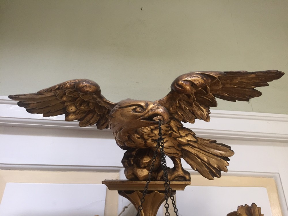 Large and impressive Regency period carved gilt-wood frame girandole convex mirror with eagle surmount. View X