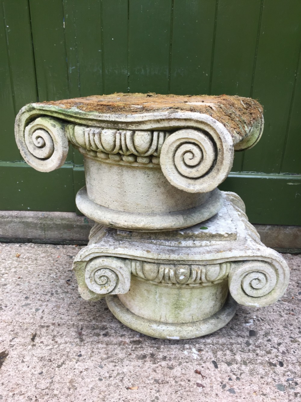 Decorative pair of early C20th composition stone ionic capitals .