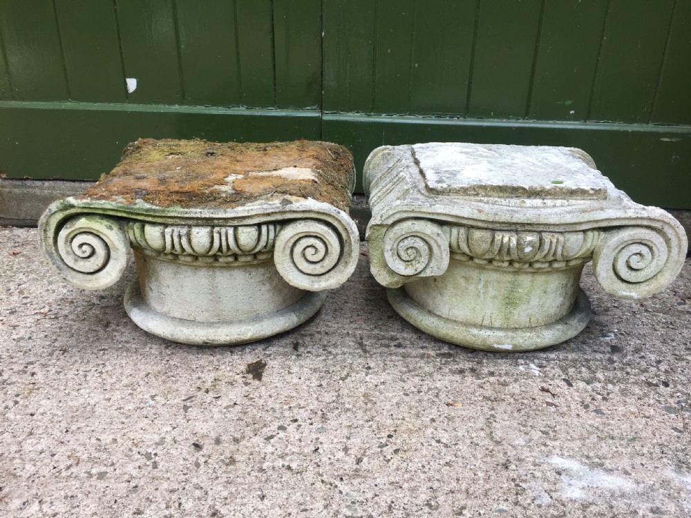 Decorative pair of early C20th composition stone ionic capitals . View III