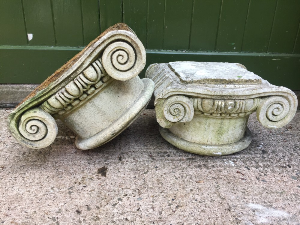 Decorative pair of early C20th composition stone ionic capitals . View IV