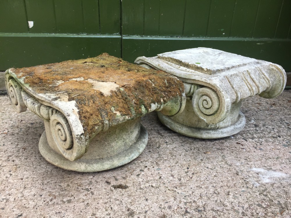 Decorative pair of early C20th composition stone ionic capitals . View V