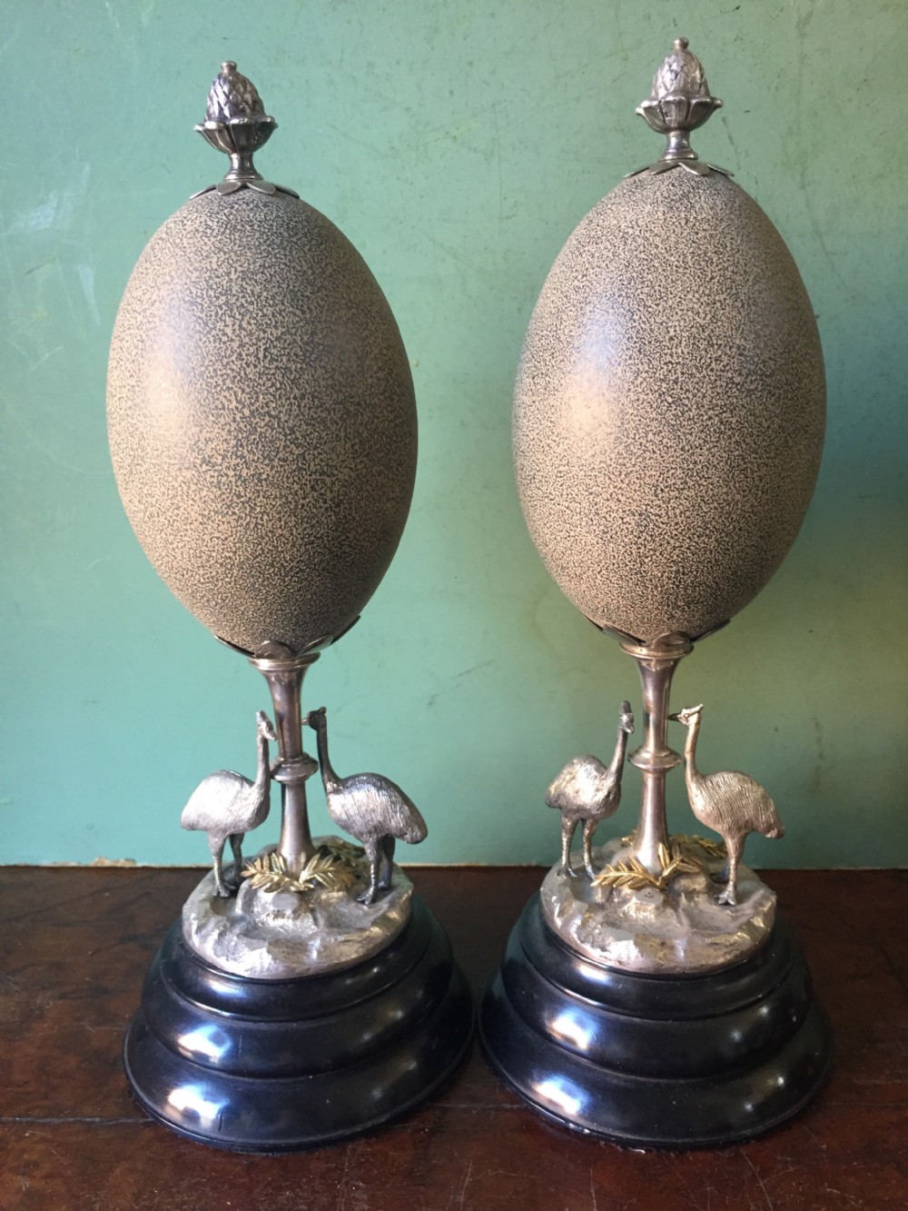 Of Australian interest: Pair of late C19th silver-plated mounted Emu eggs on ebonised socle bases. View IV