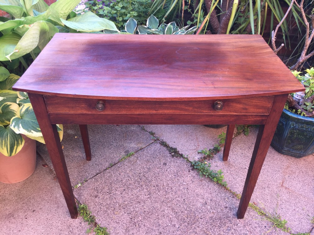 A late eighteenth-century George III mahogany side table featuring a single frieze drawer with brass handles and straight tapered legs. View XI