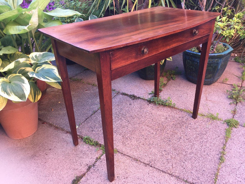 A late eighteenth-century George III mahogany side table featuring a single frieze drawer with brass handles and straight tapered legs. View XIII