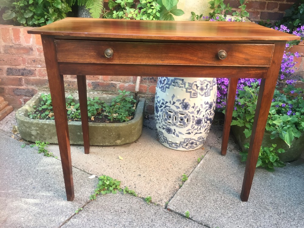 A late eighteenth-century George III mahogany side table featuring a single frieze drawer with brass handles and straight tapered legs. View XV