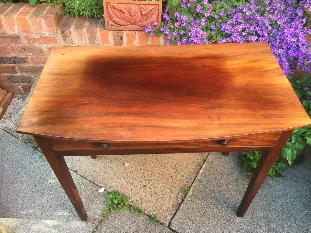 A late eighteenth-century George III mahogany side table featuring a single frieze drawer with brass handles and straight tapered legs. View XVI