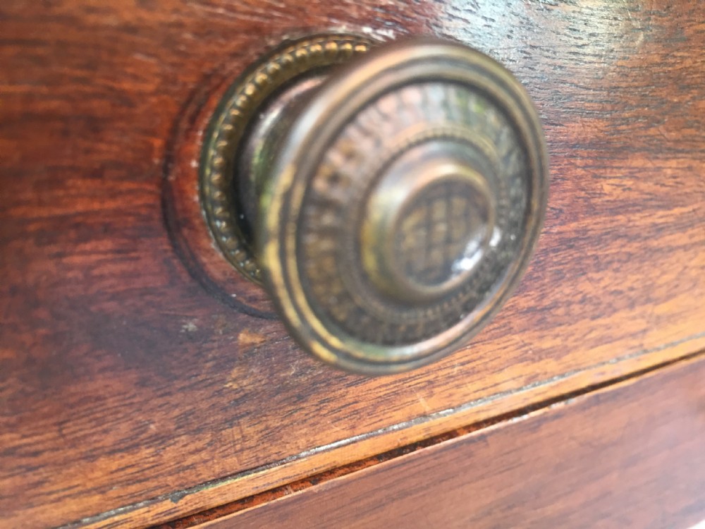 A late eighteenth-century George III mahogany side table featuring a single frieze drawer with brass handles and straight tapered legs. View XIX