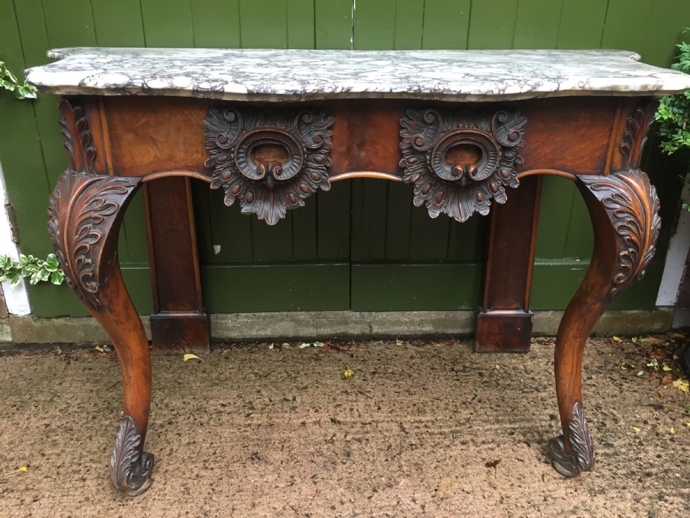 Exhuberant C19th Irish walnut console table with a rare Breccia marble slab top . View II