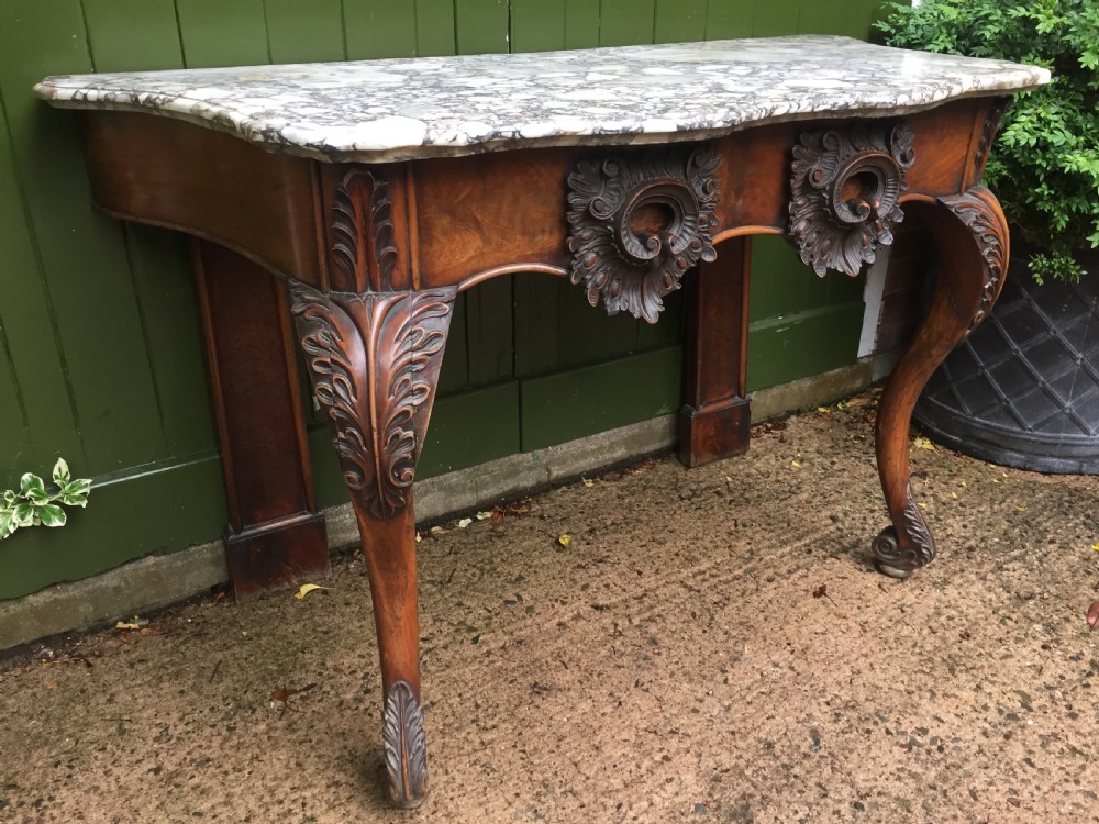 Exhuberant C19th Irish walnut console table with a rare Breccia marble slab top . View III