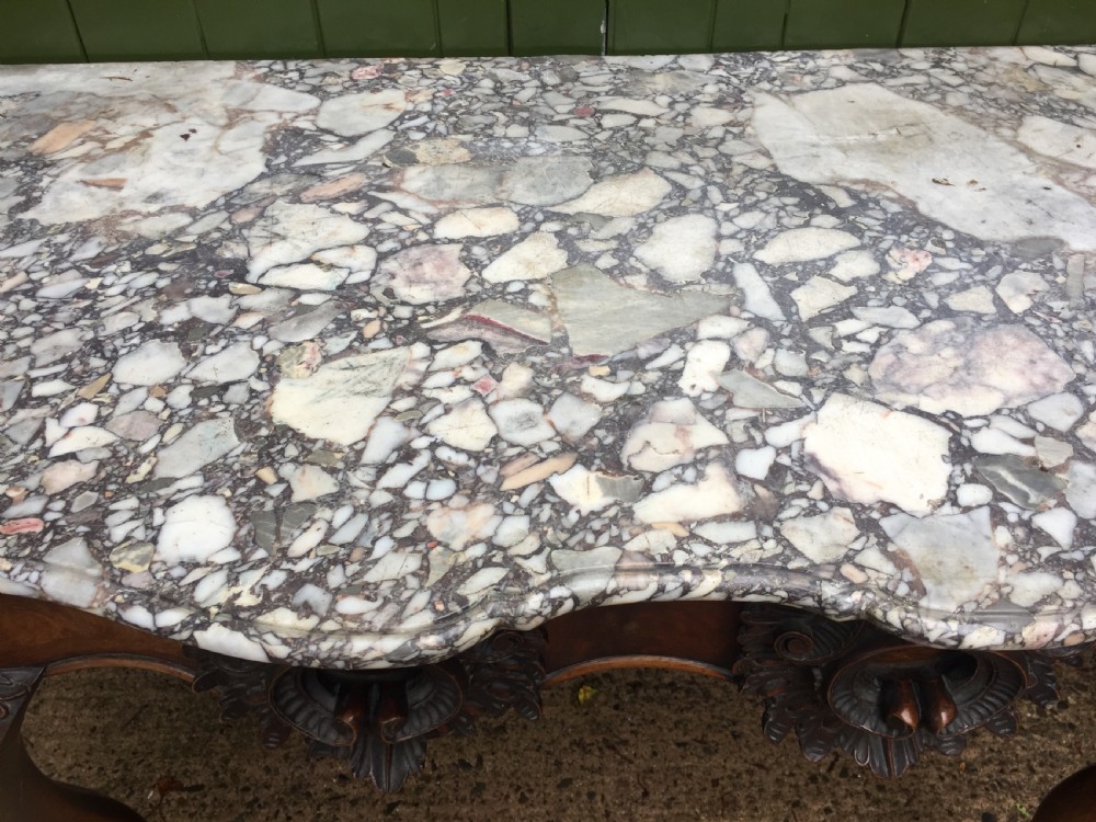 Exhuberant C19th Irish walnut console table with a rare Breccia marble slab top . View V