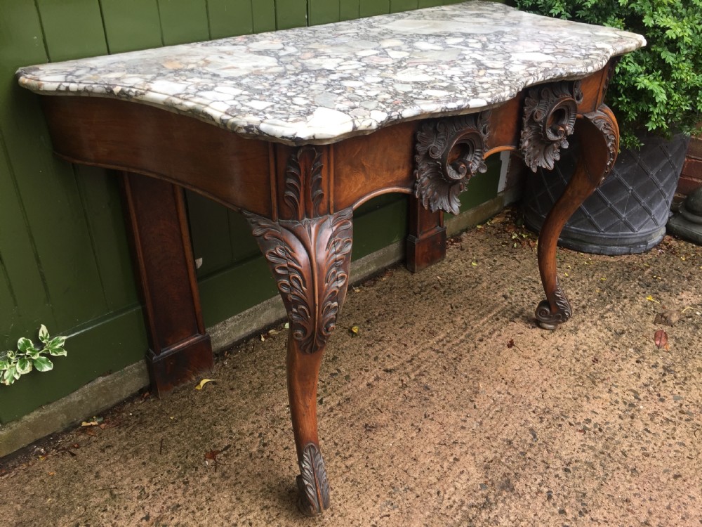 Exhuberant C19th Irish walnut console table with a rare Breccia marble slab top . View X