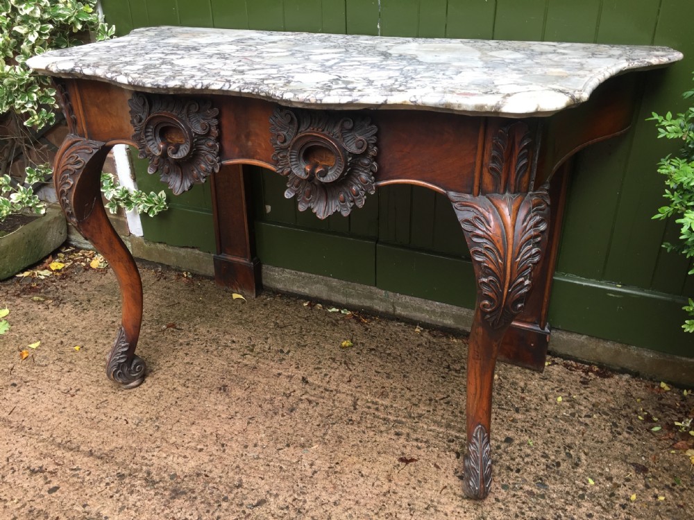 Exhuberant C19th Irish walnut console table with a rare Breccia marble slab top . View XIX