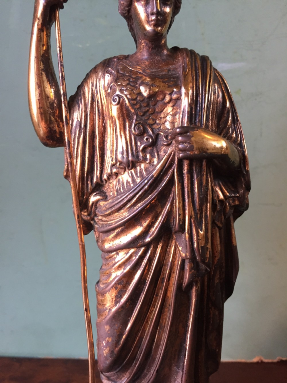 A nineteenth-century gilded bronze sculpture depicting the classical goddess Athena holding a spear, standing on a dark marble base. View XIII