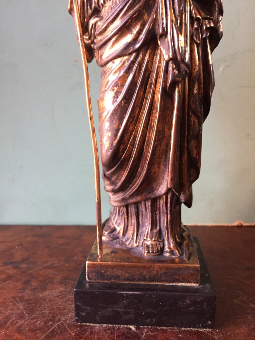 A nineteenth-century gilded bronze sculpture depicting the classical goddess Athena holding a spear, standing on a dark marble base. View XIV