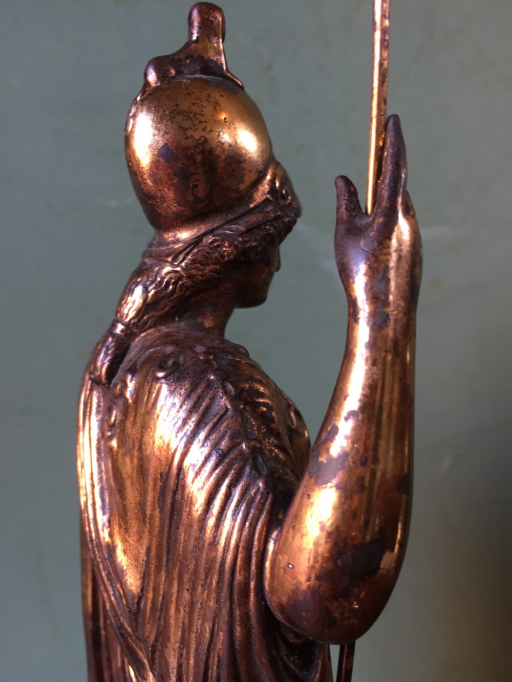 A nineteenth-century gilded bronze sculpture depicting the classical goddess Athena holding a spear, standing on a dark marble base. View XVII