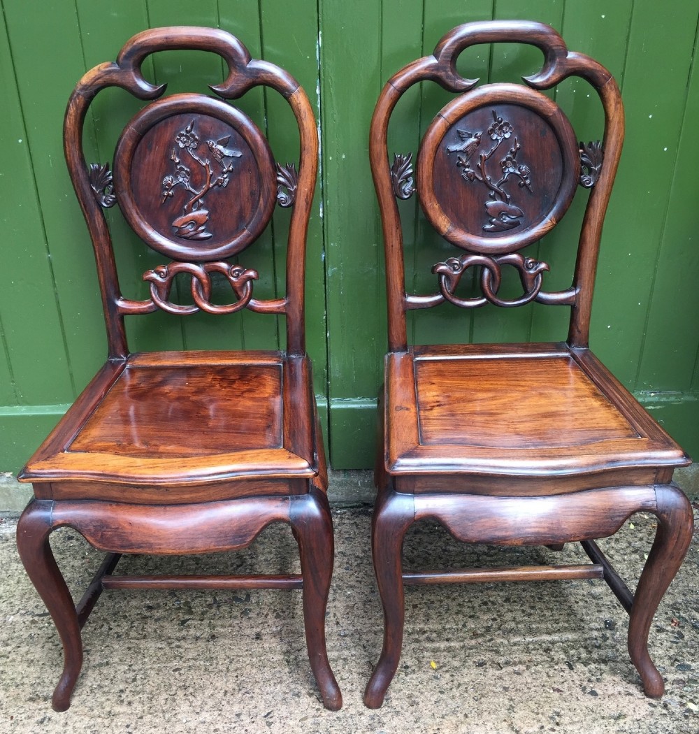 Pair of late C19th Chinese Qing Dynasty carved hardwood hall or side chairs.