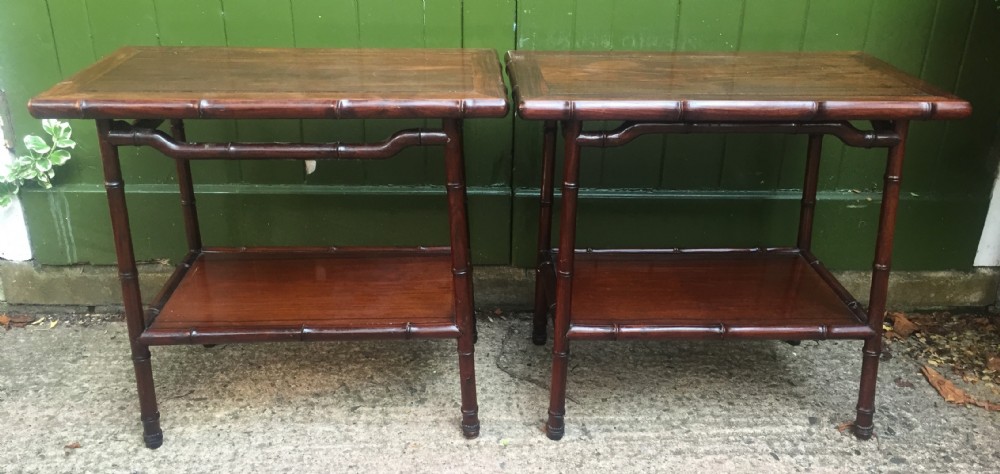 Pair of early C20th Chinese carved hardwood 2-tier end or occasional tables .