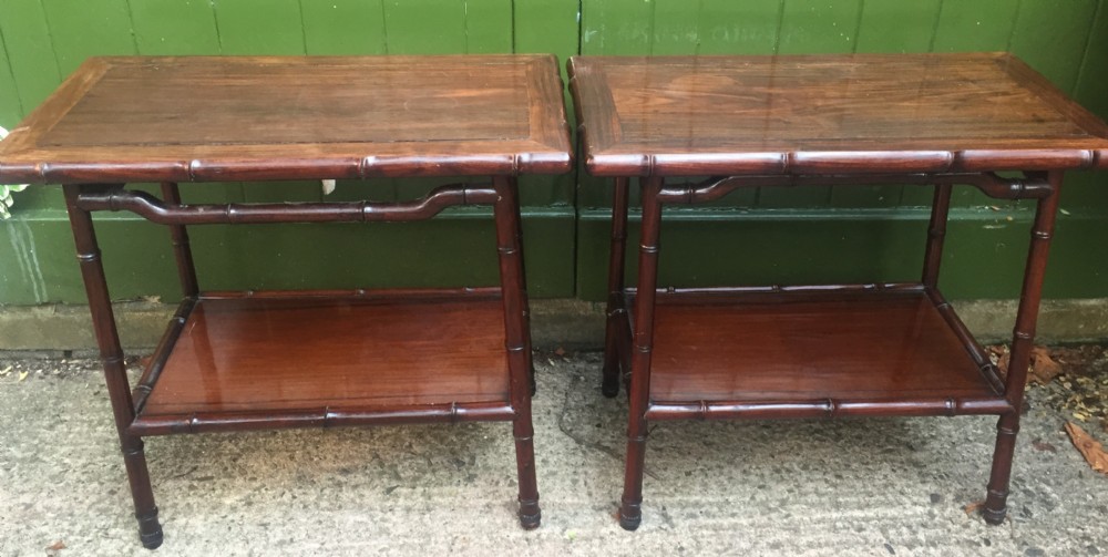 Pair of early C20th Chinese carved hardwood 2-tier end or occasional tables . View II