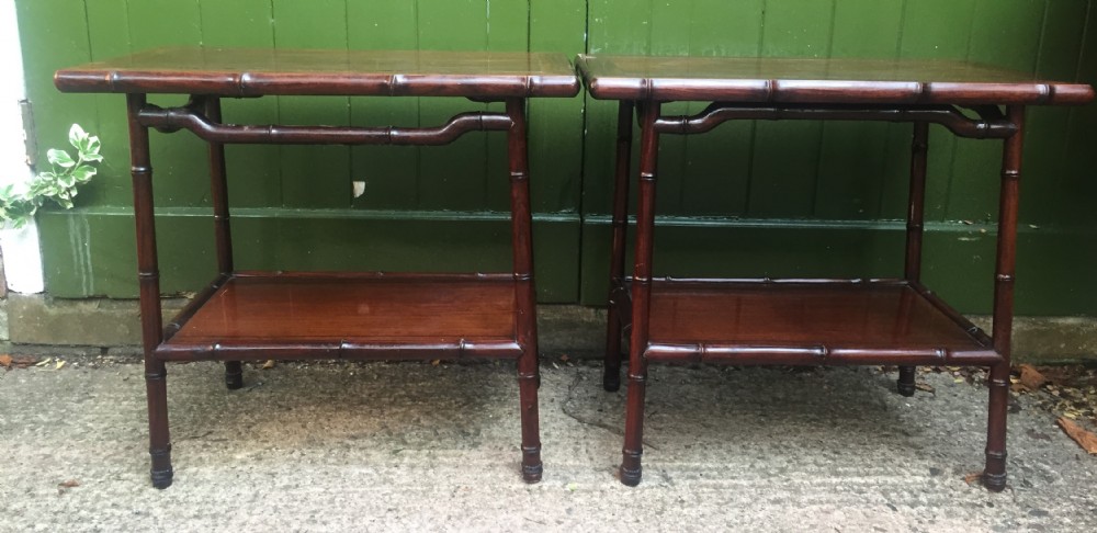 Pair of early C20th Chinese carved hardwood 2-tier end or occasional tables . View III
