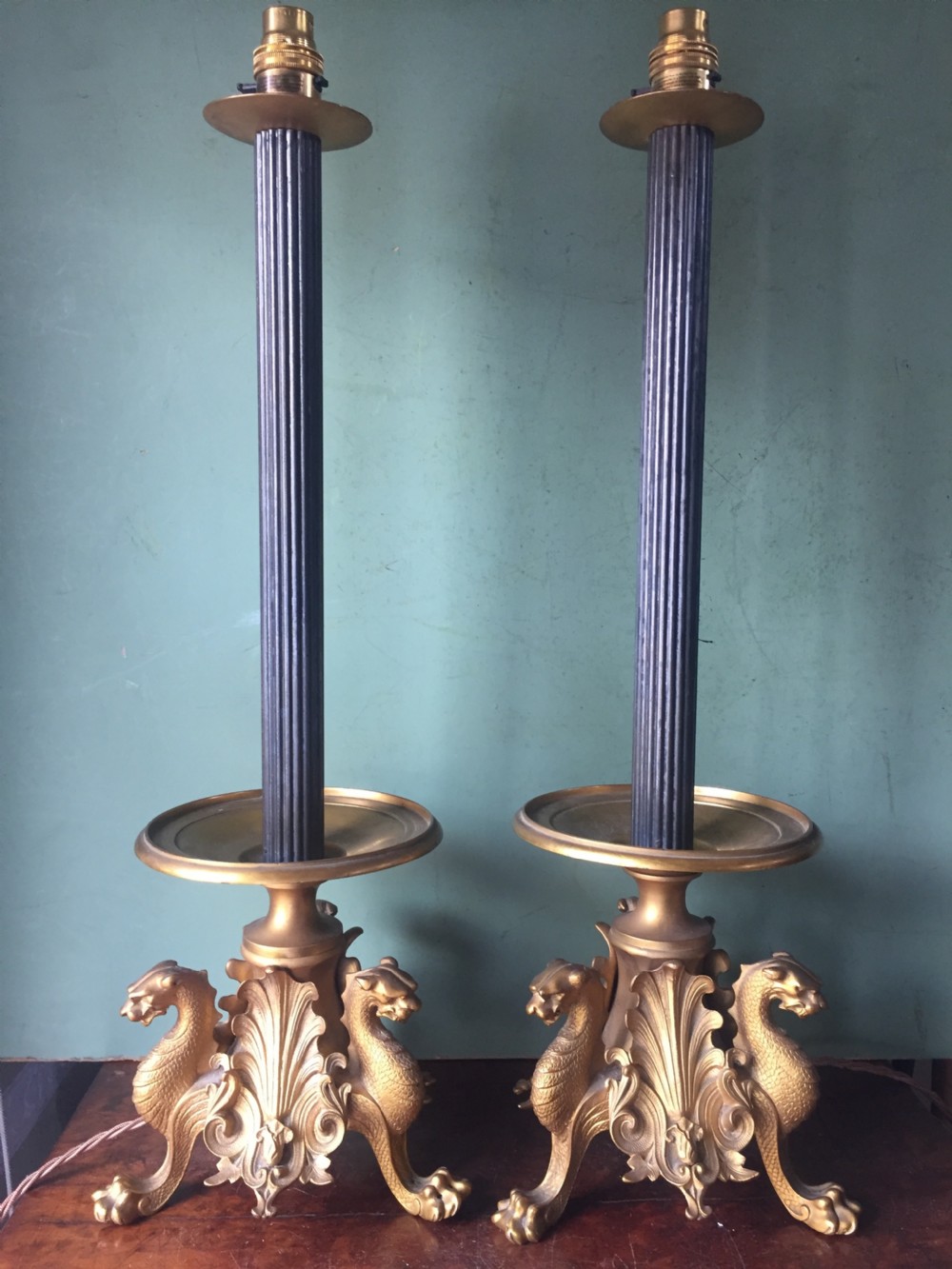 Pair of late C19th French gilt and patinated bronze lamps raised on tri-form griffin supports. View II