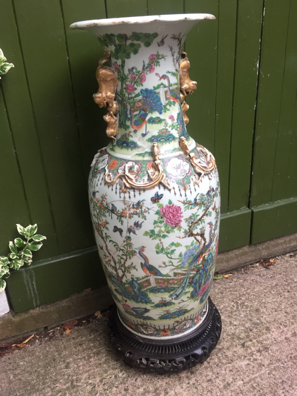 Large scale C19th Chinese Cantonese porcelain enamel decorated vase on hardwood stand in repaired 'country house' condition . View III